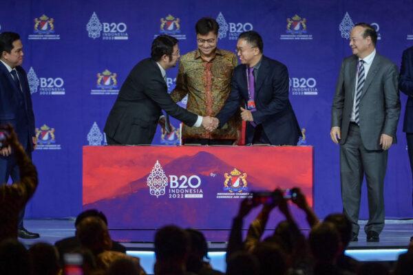 Chairman of Chinese battery company CATL Zeng Yuqun (R), Indonesian State-owned Enterprises Minister Erik Tohir (2nd L), and CATL vice president Jiang Li (2nd R) at the signing ceremony of a $2 billion EV fund during the B20 Summit as part of the G20 dialogue, in Bali, Indonesia, on Nov. 14, 2022. (BAY ISMOYO/AFP via Getty Images)