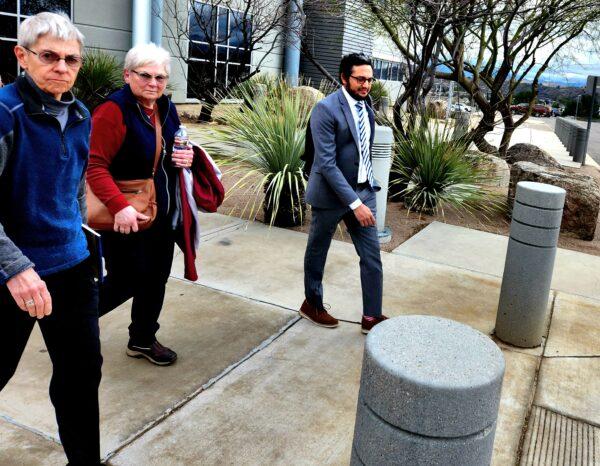 Wanda Kelly (2L), wife of George Alan Kelly, accused of first-degree murder in the shooting death of an illegal alien on Jan. 30, leaves the Nogales Justice Center in Nogales, Ariz., following a hearing on Feb. 22, 2023. (Allan Stein/The Epoch Times)