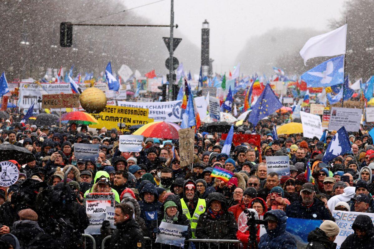 People protest against the delivery of weapons to Ukraine and support peace negotiations between Russia and Ukraine, in Berlin, Germany, on Feb. 25, 2023. (Christian Mang/Reuters)