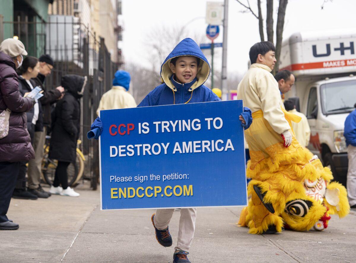 Falun Gong practitioners walk in a parade in Brooklyn, N.Y., highlighting the Chinese regime's persecution of their faith on Feb. 26, 2023. (Chung I Ho/The Epoch Times)