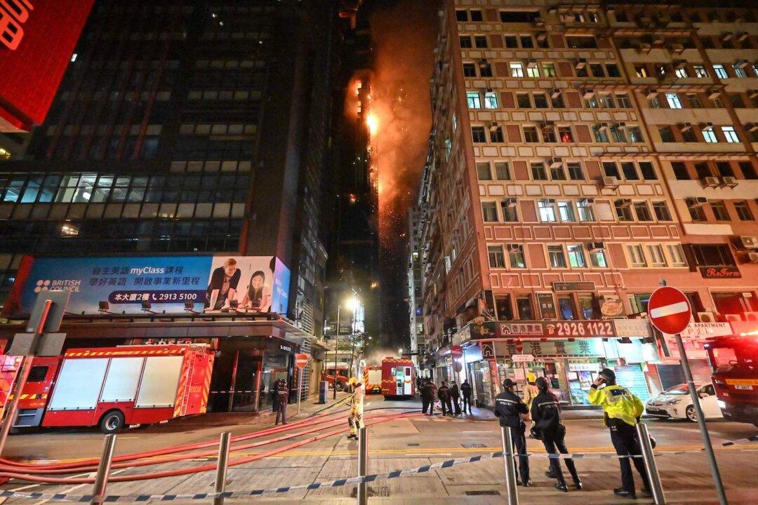 Hong Kong Firefighters Battle Blaze at High Rise Construction Site