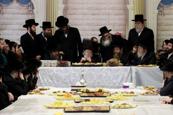 Ultra-Orthodox Jews celebrate the feast of Tu Bishvat, or Tress New Year, at a synagogue in the Israeli central city of Rehovot on Feb. 6, 2023. (Gil Cohen-Magen/AFP via Getty Images)