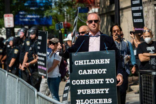 Activist Chris Elston, known as "Billboard Chris", demonstrates with others against so-called "gender-affirming care" for minors at a rally outside Boston Children's Hospital in Massachusetts on Sept. 18, 2022. (Joseph Prezioso / AFP via Getty Images)