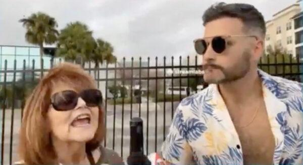 Jon Eugene Minadeo II, who leads an anti-Jewish group in Florida, conducts a video interview with a Jewish woman outside of the Chabad of South Orlando on February 22, 2023. (Screenshot courtesy of Minadeo)