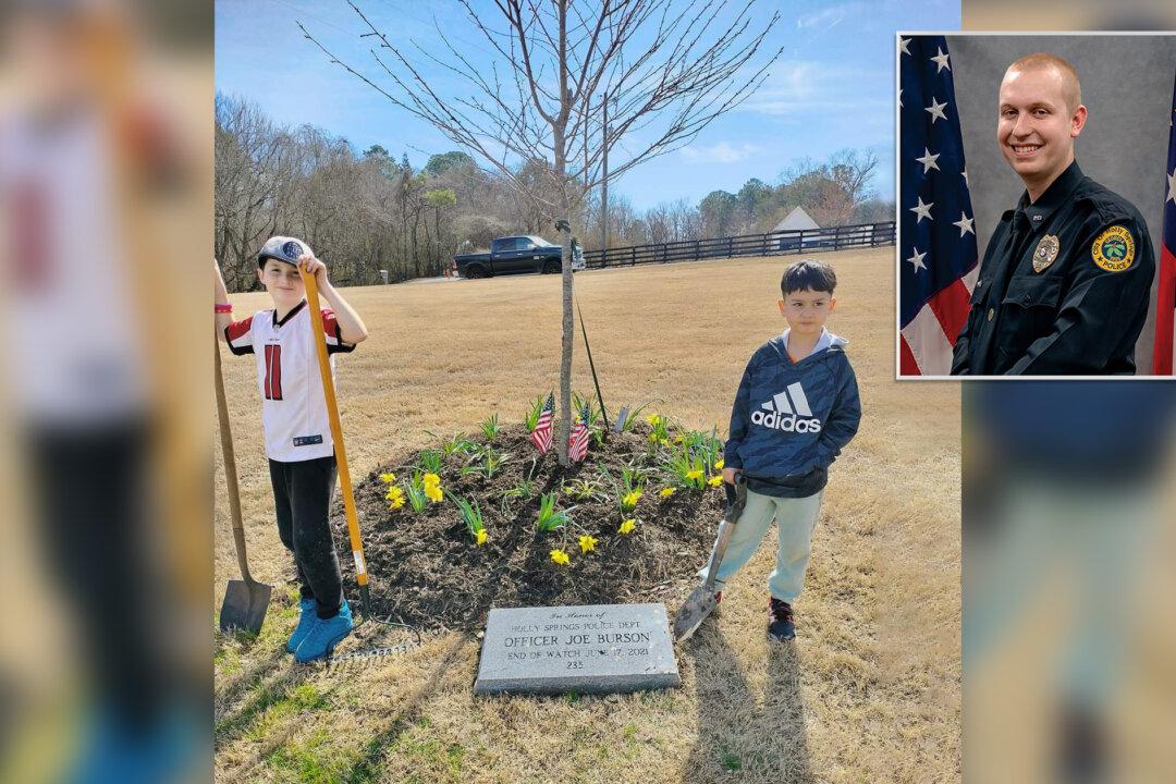 Boys Spend Weekend Planting Flowers at Memorial of Young Officer Killed in the Line of Duty