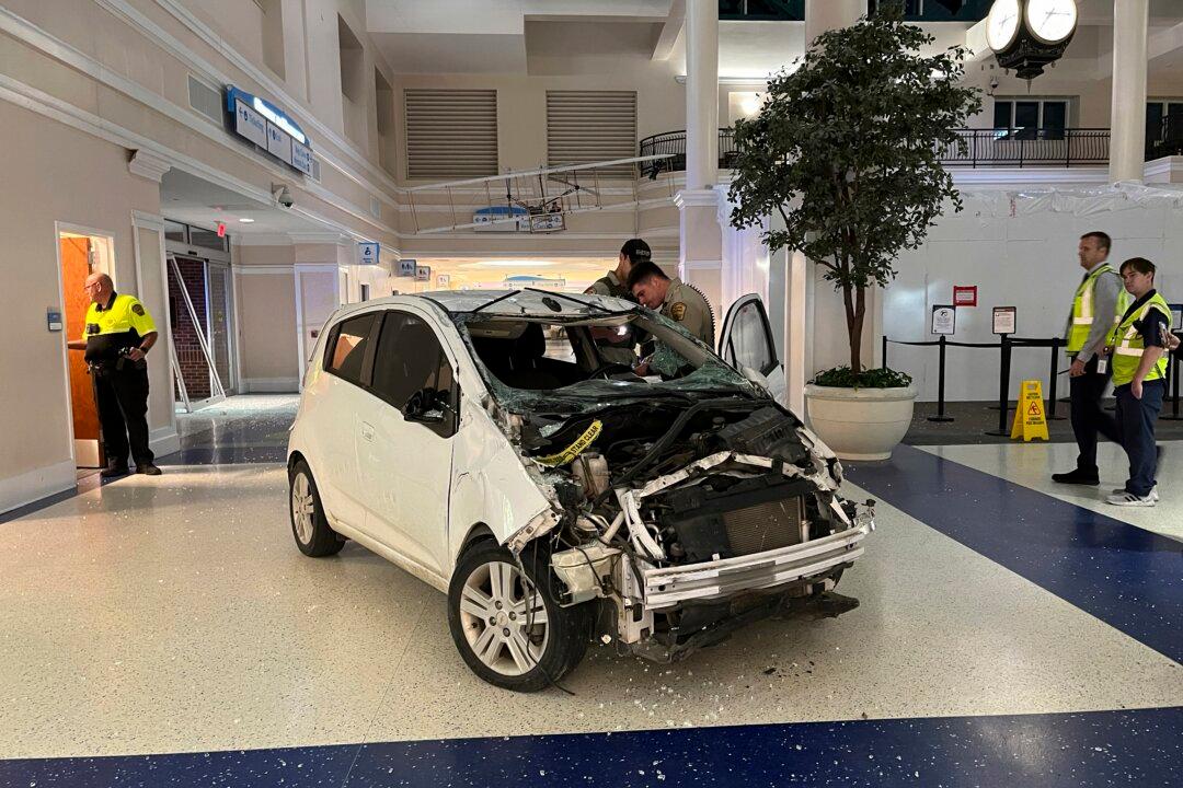 Sheriff: Vehicle Crashes in Airport Terminal, Driver Charged