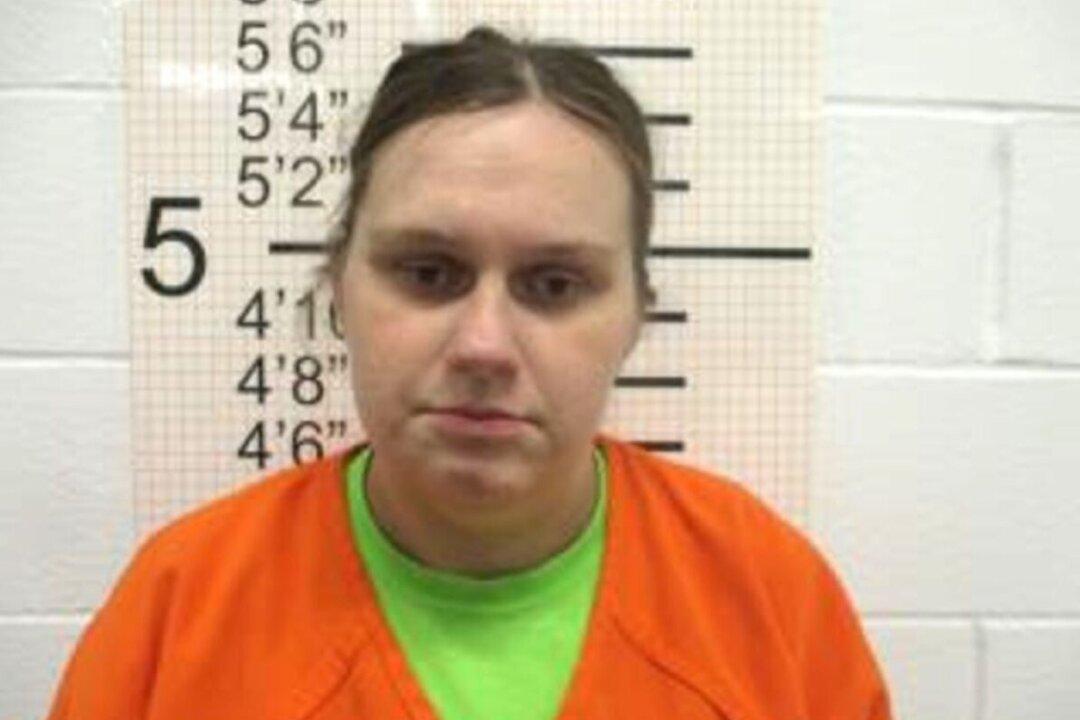 Newborn Found Dead in Iowa Ditch; Mother, Grandfather Charged