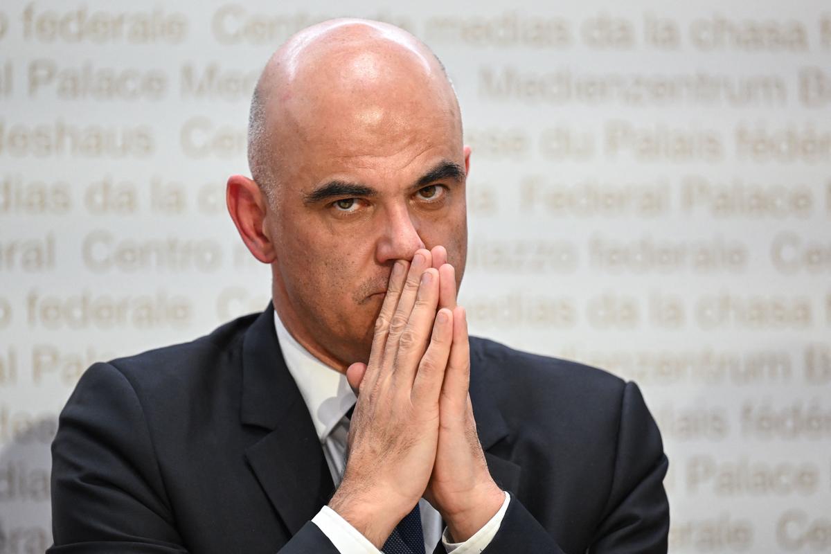 Swiss President Alain Berset gestures as he attends a press conference after talks over UBS taking over its rival Swiss bank Credit Suisse, in Bern on March 19, 2023. (FABRICE COFFRINI/AFP via Getty Images)