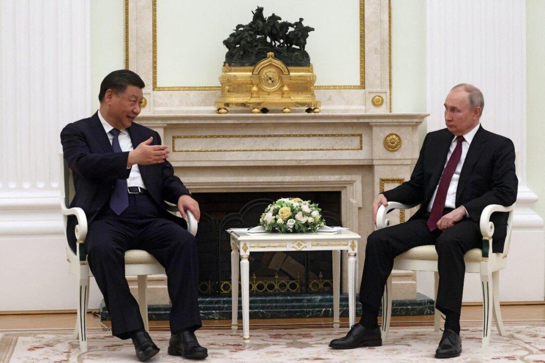 As China’s Xi Arrives in Moscow, Experts Say Peace Efforts a Smoke Screen