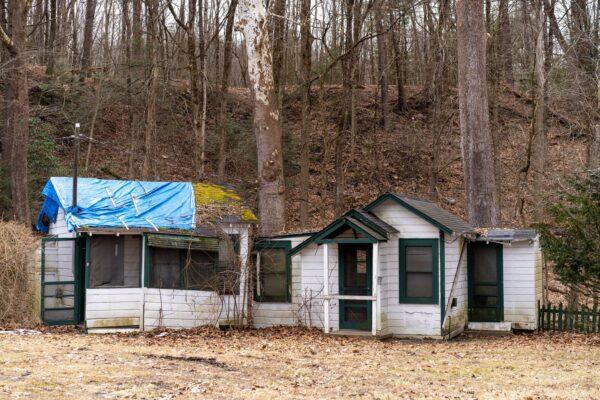 Two of the small houses at the site of the future veteran village on Main Street in Port Jervis, N.Y., on March 17, 2023. (Cara Ding/The Epoch Times)
