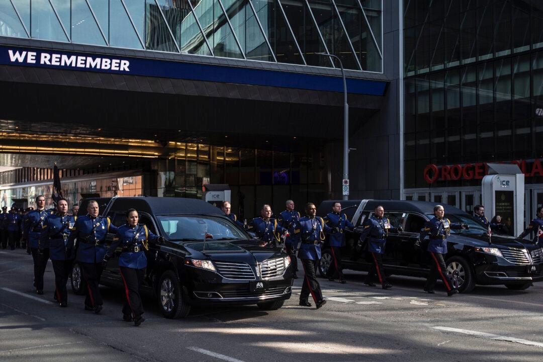 Thousands of Officers March in Funeral Procession for Two Edmonton Police Constables Killed on Duty