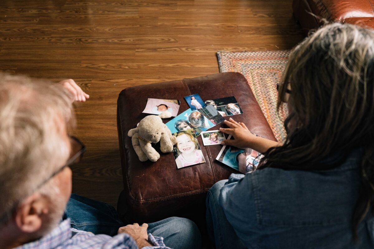 Gil and Gabriella Reid look at photos of their estranged daughter in Belton, S.C., on March 25, 2023. (Jack Robert for The Epoch Times)