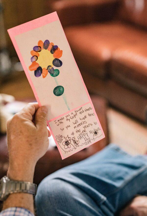 Gil and Gabriella Reid look at drawings by their estranged daughter at their home in Belton, S.C., on March 25, 2023. (Jack Robert for The Epoch Times)