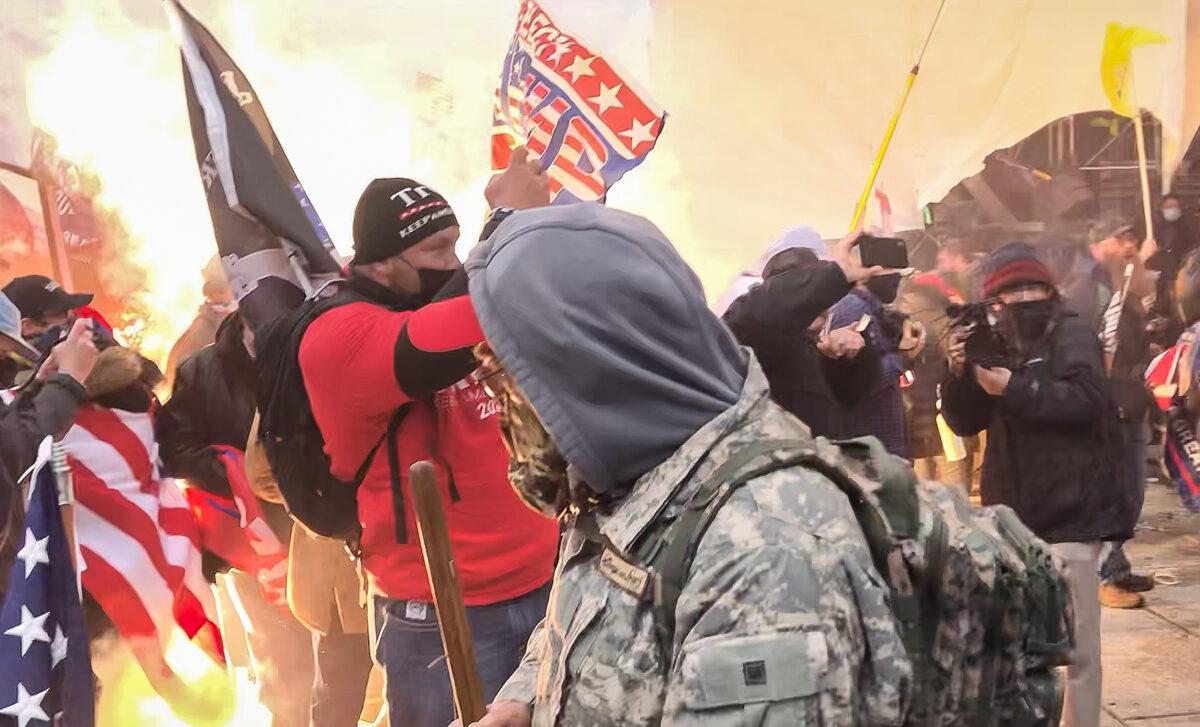 A munition detonates at protesters' feet on the west front of the U.S. Capitol on Jan. 6, 2021. (Steve Baker/Special to The Epoch Times)