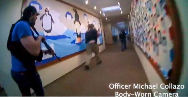 Nashville Police Department officers rush toward the shooter in the Covenant School shooting in Nashville, Tenn., on March 28, 2023. (Nashville Police Department via The Epoch Times)