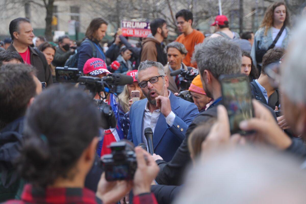 Protesters outside the New York County Criminal Court ahead of former President Donald Trump's arraignment on April 4, 2023. (Chung I Ho/The Epoch Times)