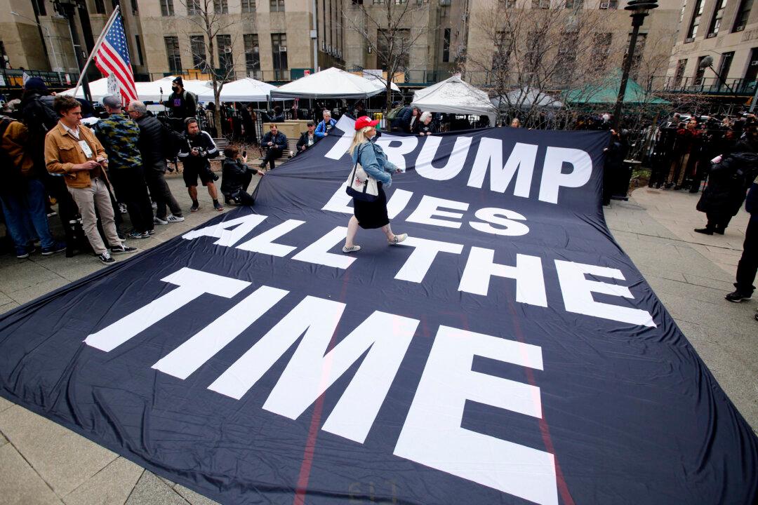 Photos: Protesters Rally Outside Manhattan Courthouse Ahead of Trump Arraignment