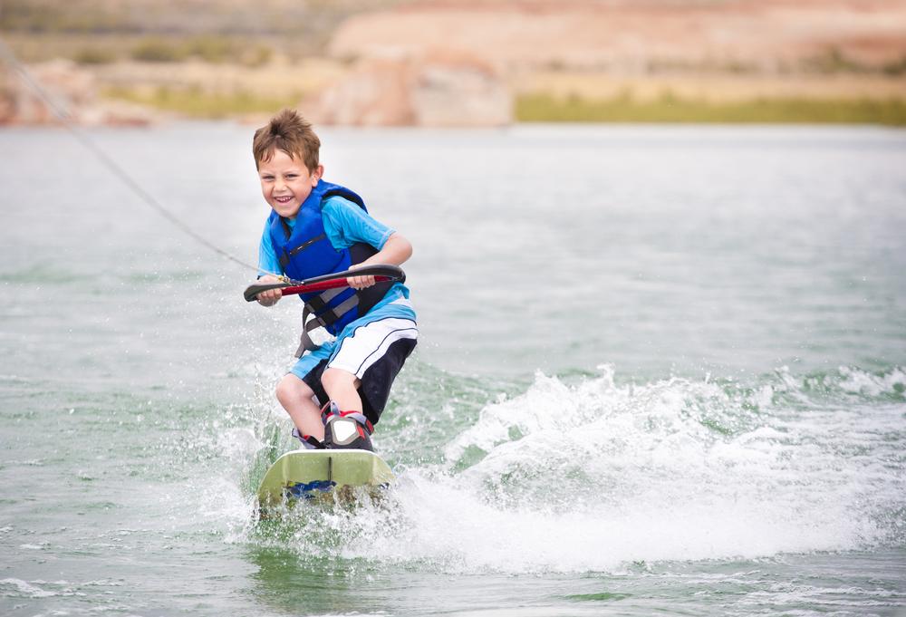 If your child loves the water, look for a camp that offers supervised swimming, canoeing, and water skiing activities. (Brocreative/Shutterstock)