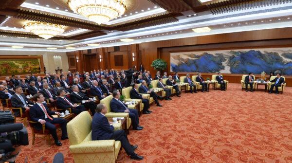 Overseas representatives of China Development Forum, including Mark Zuckerberg, Facebook CEO (L), attend a meeting at the Great Hall of the People, on March 21, 2016. (Kenzaburo Fukuhara/Getty Images)
