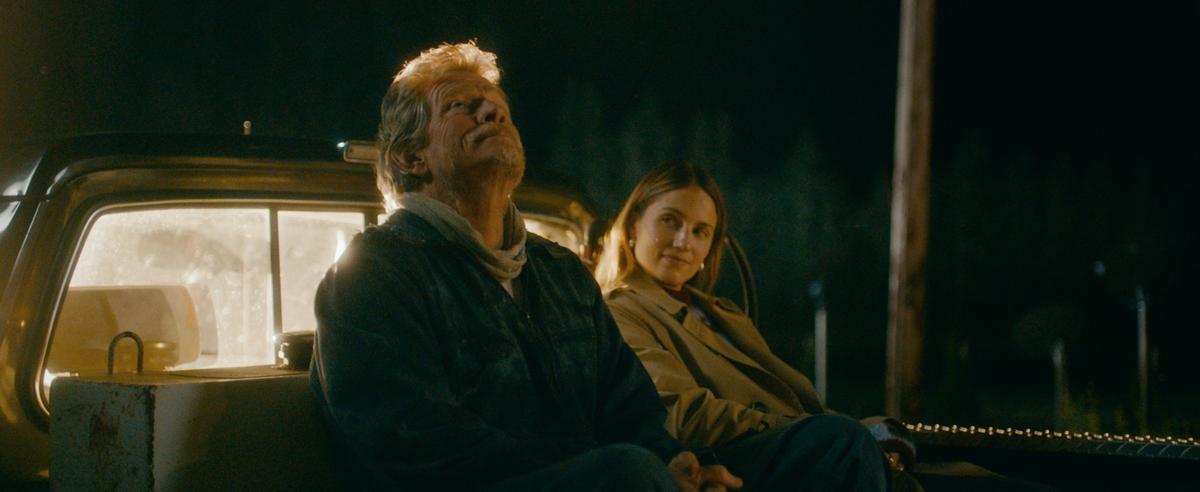 Lloyd (Thomas Haden Church) and Maggie (Dianna Agron) sit in the back of Loyd's truck, in "Acidman." (Brainstorm media)
