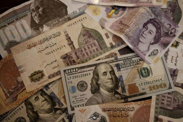 Egyptian pound, British pound sterling, and U.S. dollar banknotes on Aug. 25, 2022. (Khaled DESOUKI/AFP via Getty Images)