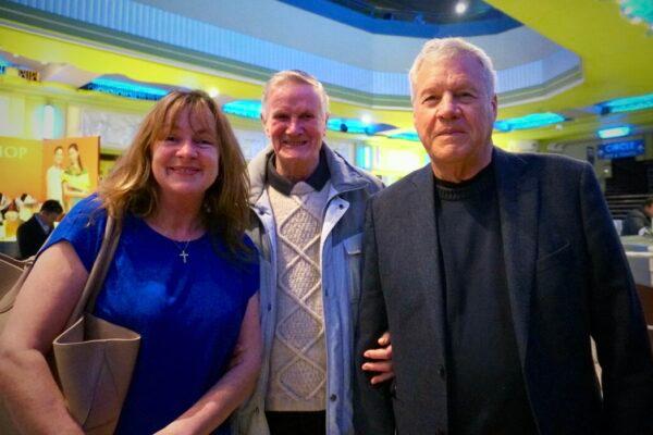 (L–R) Jane MacDonald-Styslinger, her father, and her husband, Bill Styslinger, attended Shen Yun Performing Arts at the Eventim Apollo, in London, on April 14, 2023. (Mary Mann/The Epoch Times)