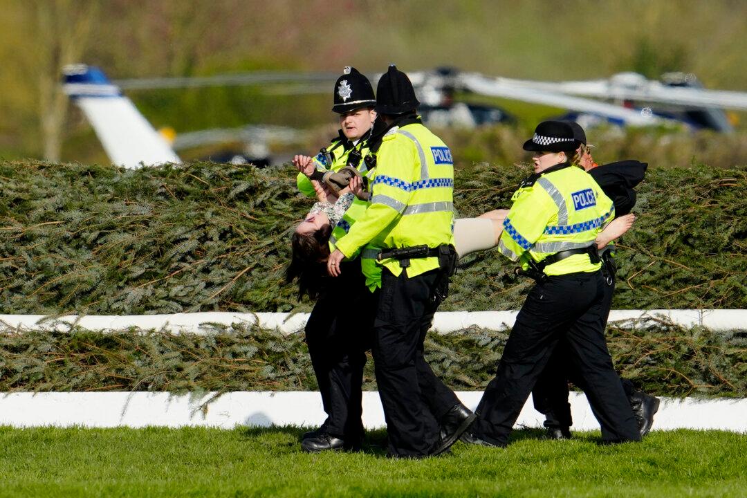 More Than 100 Arrested as Activists Delay Grand National