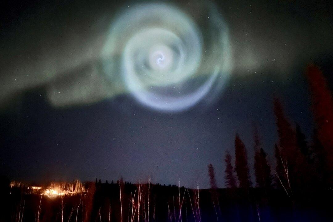 Odd Spiral Appears Amid Northern Lights in Alaska Night Sky
