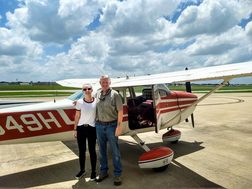 Capt. Bob Snow and his daughter, Alexandra, pose near a Cessna airplane. (Courtesy of Bob Snow)