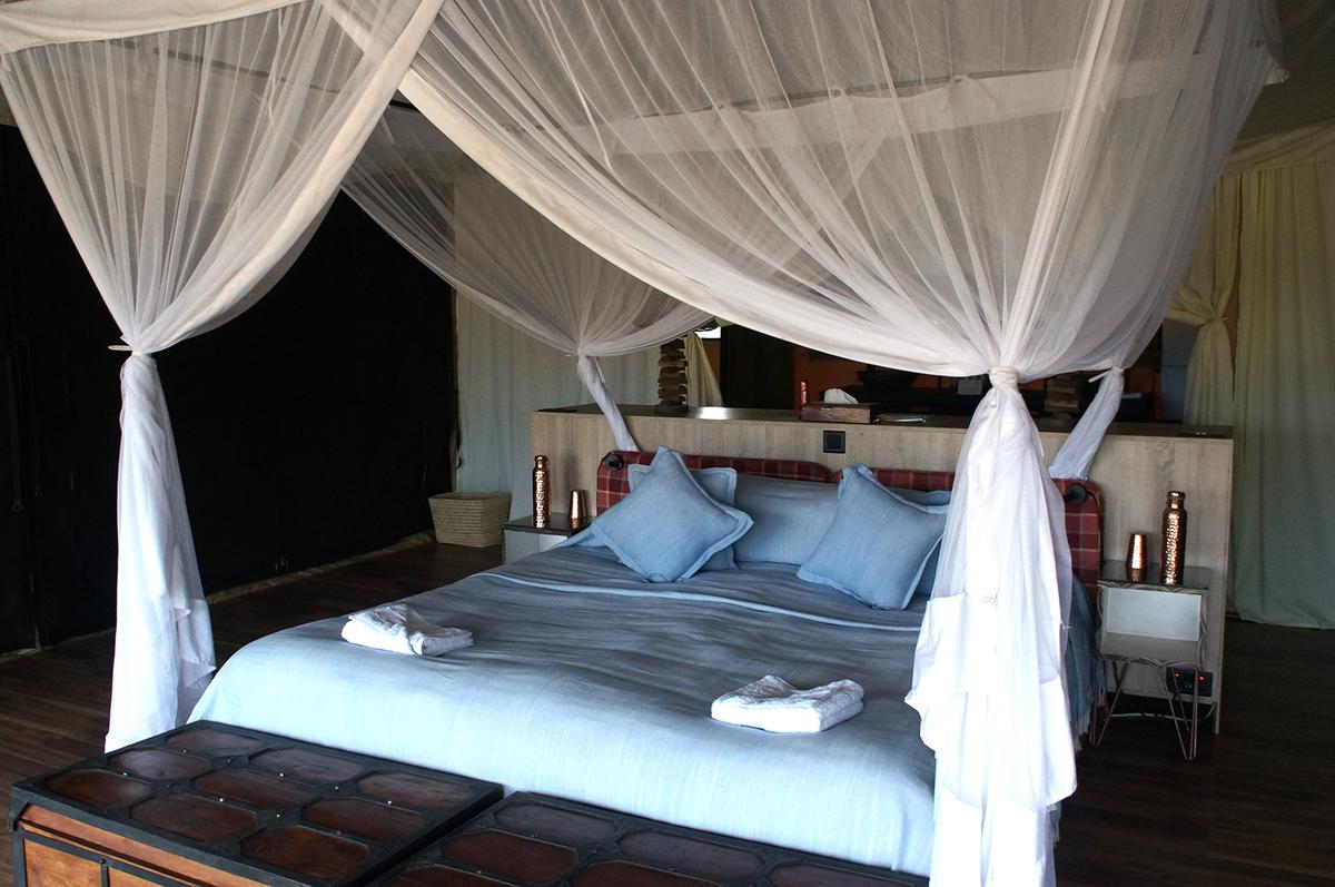 Mosquito netting doubles as decorative framing of the bed during the day. (Colleen Thomas/TNS)