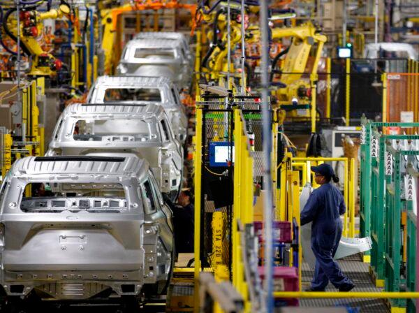 Workers assemble cars at Ford's Assembly Plant in Chicago, Ill., on June 24, 2019. (Jim Young/AFP via Getty Images)