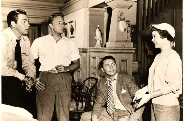 (L–R) Mike Jamison (Howard Keel), Michael Lawrence (Van Johnson), Mike Tracy (Barry Sullivan), and Marcy Lewis (Jane Wyman) meet in “Three Guys Named Mike.” (Metro-Goldwyn-Mayer)