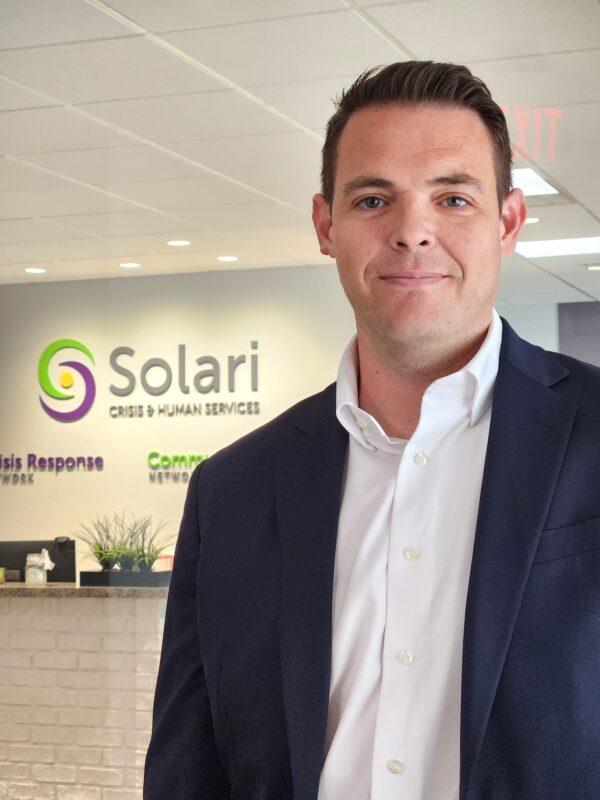 Solari Crisis and Human Services COO Andrew Erwin discusses the nationwide behavioral health crisis on April 13, 2023. (Allan Stein/The Epoch Times)