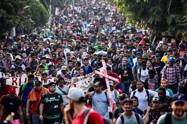 Migrants from Central and South America take part in a caravan attempting to reach the Mexico-U.S. border while protesting against the deaths of 40 migrants in a fire at a detention center in the northern city of Juarez, Mexico, on April 23, 2023. (Stringer/AFP via Getty Images)