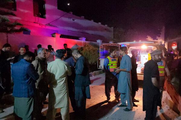 Plainclothes police officers and rescue workers gather close to the site of a bomb explosion, in Kabal, an area of Pakistan's Swat Valley on April 24, 2023. (Sherin Zara/AP Photo)