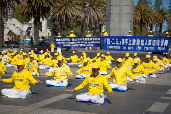 Falun Gong practitioners demonstrate the exercises at an event commemorating the 1999 peaceful appeal, in San Francisco on April 22, 2023. (Lear Zhou/The Epoch Times)
