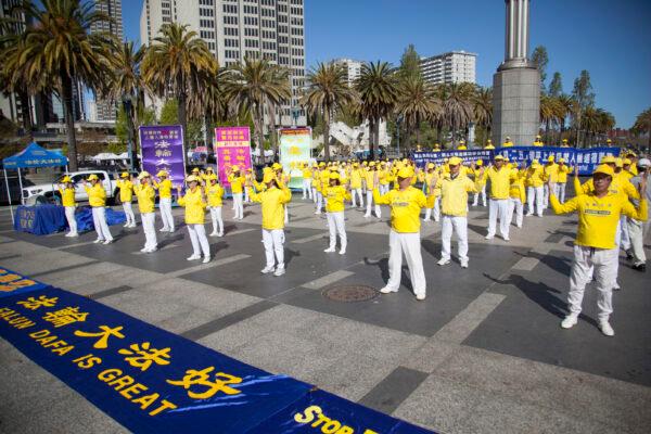 Falun Gong practitioners demonstrate the exercises at an event commemorating the 1999 peaceful appeal, in San Francisco on April 22, 2023. (Lear Zhou/The Epoch Times)