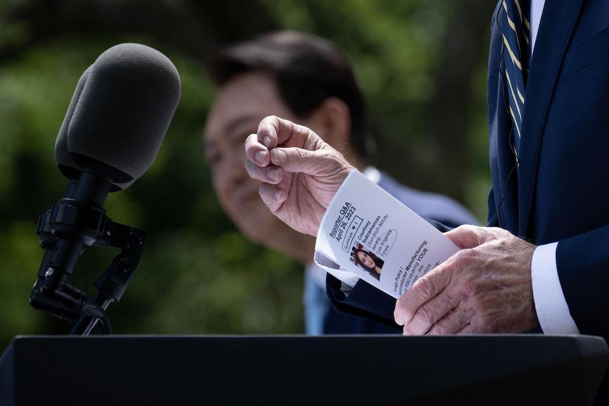 President Biden Holds Note With Reporter’s Question Before Calling on Her