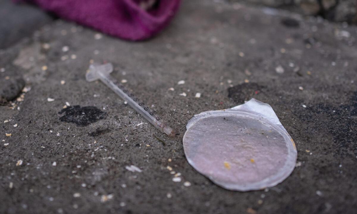 A used syringe sits discarded on the sidewalks of San Francisco on Feb. 23, 2023. (John Fredricks/The Epoch Times)