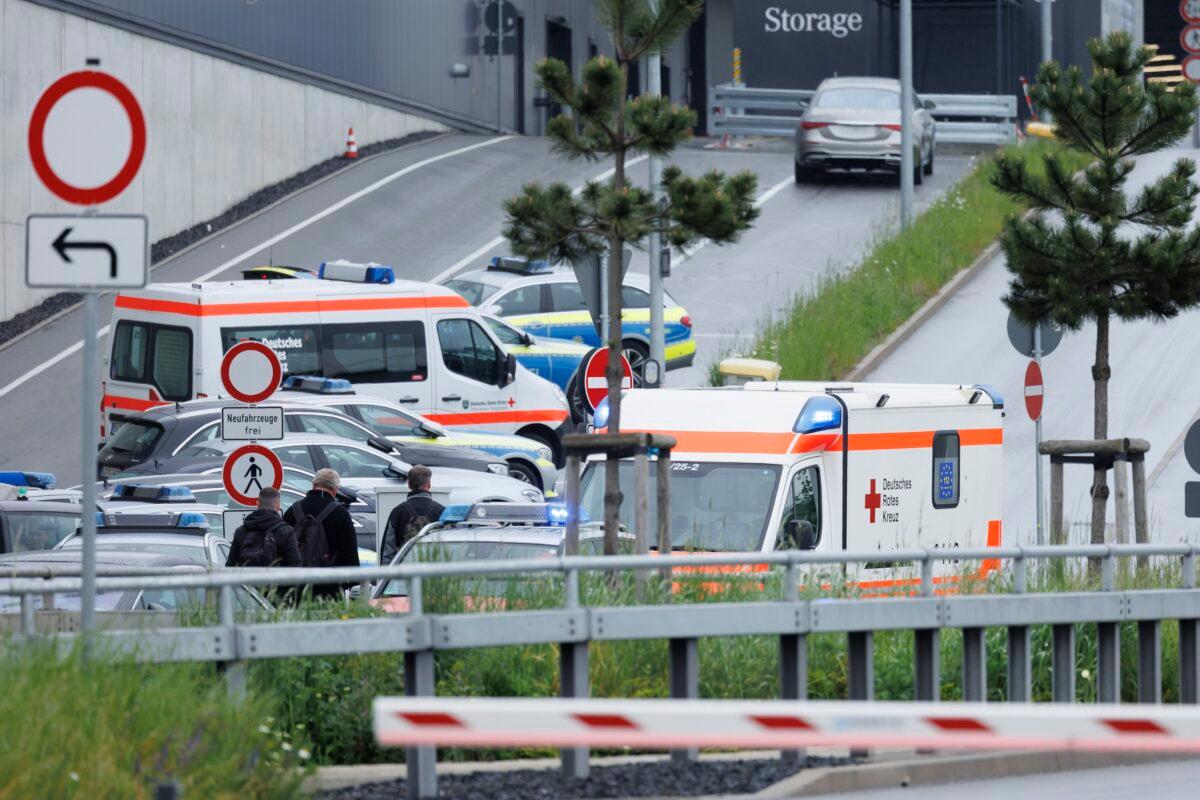 Police emergency vehicles are parked at a Mercedes-Benz plant in Sindelfingen, Germany, on May 11, 2023. (Julian Rettig/dpa via AP)
