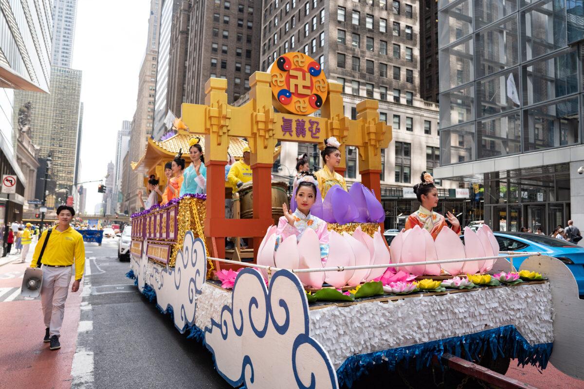 Falun Gong practitioners march in Manhattan to celebrate World Falun Dafa Day on May 12, 2023. (Samira Bouaou/The Epoch Times)