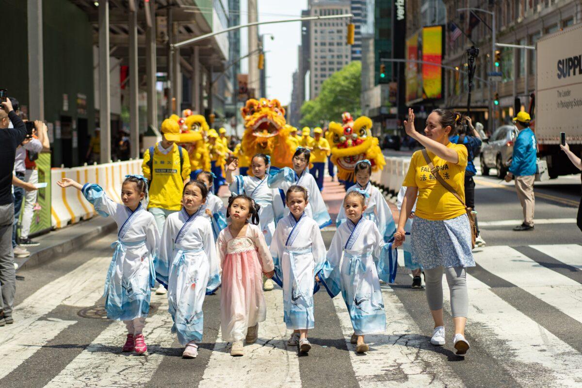 Falun Gong practitioners march in Manhattan to celebrate World Falun Dafa Day on May 12, 2023. (Samira Bouaou/The Epoch Times)