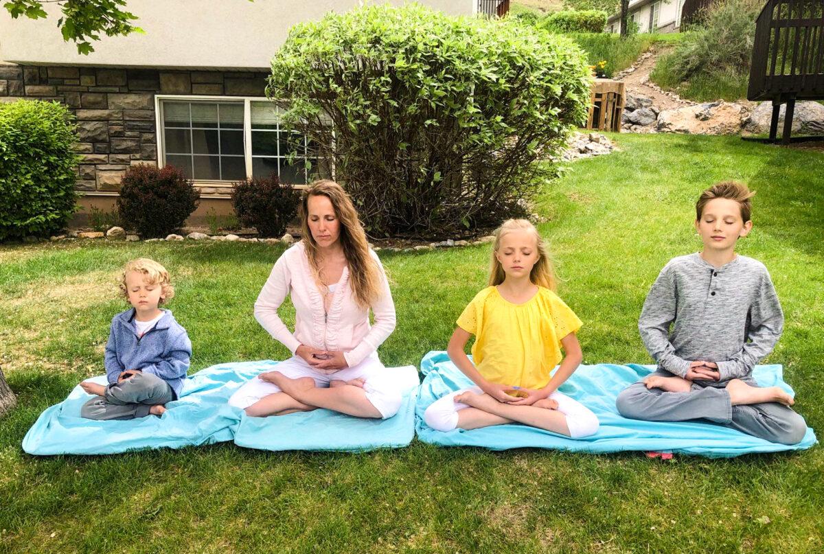 Jami Smith meditates with her children in the front yard of their house in Springville, Utah, in May 2020. (Courtesy of Jami Smith)