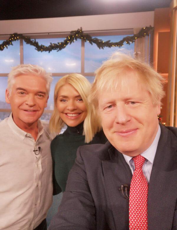 Handout photo taken from the X feed of Prime Minister Boris Johnson with presenters Phillip Schofield and Holly Willoughby during ITV's "This Morning" in December 2019. (Boris Johnson/X/PA)
