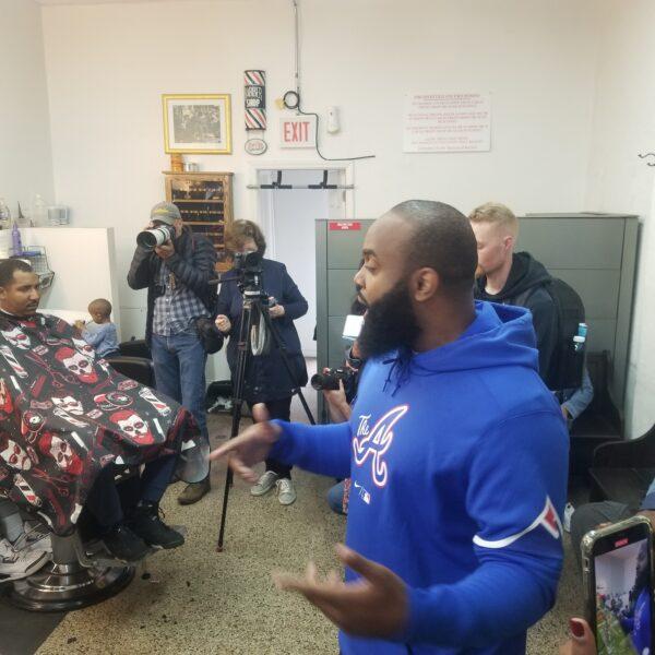 Will Calloway speaks to 2024 Republican presidential hopeful Vivek Ramaswamy at a Chicago barbershop on May 19, 2023. (Nathan Worcester/The Epoch Times)