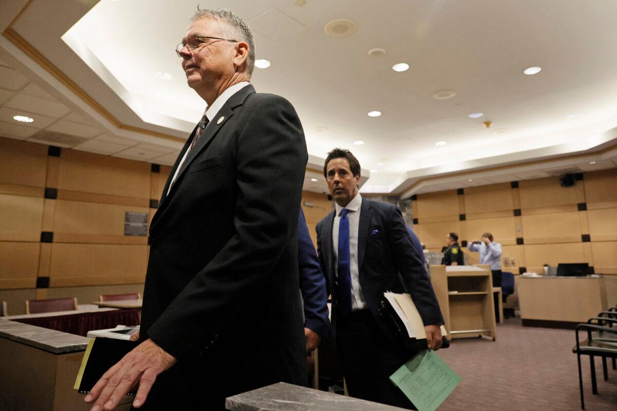 Former Marjory Stoneman Douglas High School School Resource Officer Scot Peterson (L) leaves the courtroom with his defense lawyer Mark Eiglarsh following a hearing in his case at the Broward County Courthouse in Fort Lauderdale, Fla., on May 22, 2022. (Amy Beth Bennett/South Florida Sun-Sentinel via AP, Pool)