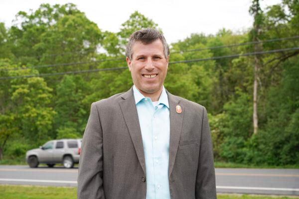 Neil Meyer in front of Route 211 in the Town of Wallkill, N.Y., on May 19, 2023. (Cara Ding/The Epoch Times)