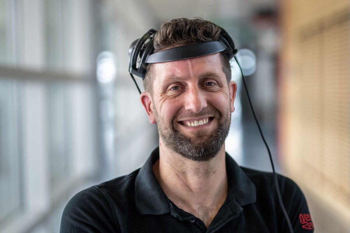 Gert-Jan Oskam, 40, victim of a spinal cord injury that left him paralyzed, poses with his implants that allows him to walk naturally during a press conference in Lausanne, Switzerland, on May 23, 2023. (Fabrice Coffrini/AFP via Getty Images)