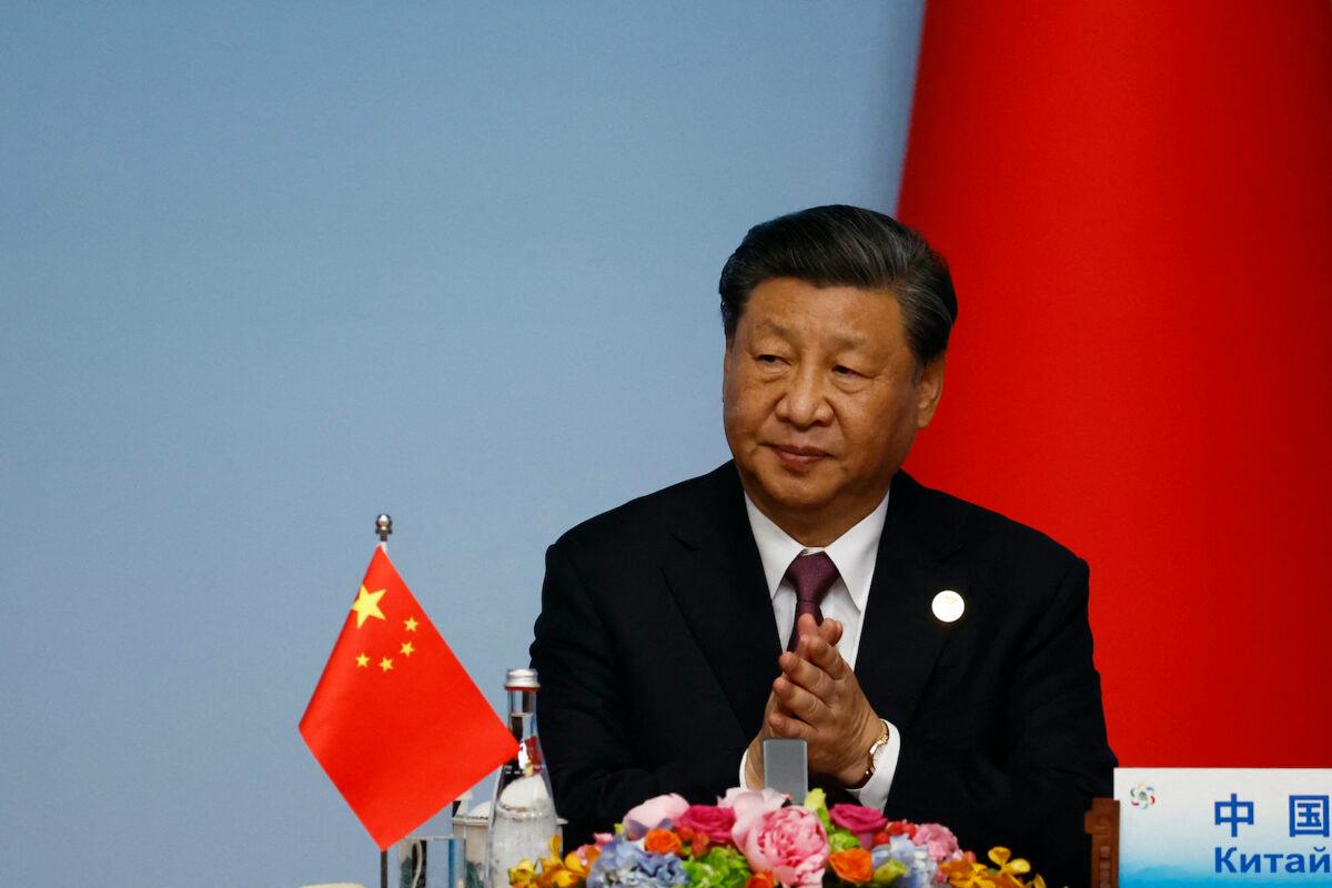Chinese leader Xi Jinping applauds during the joint press conference of the China-Central Asia Summit in Xian, in China's northern Shaanxi Province on May 19, 2023. (Florence Lo/POOL/AFP via Getty Images)