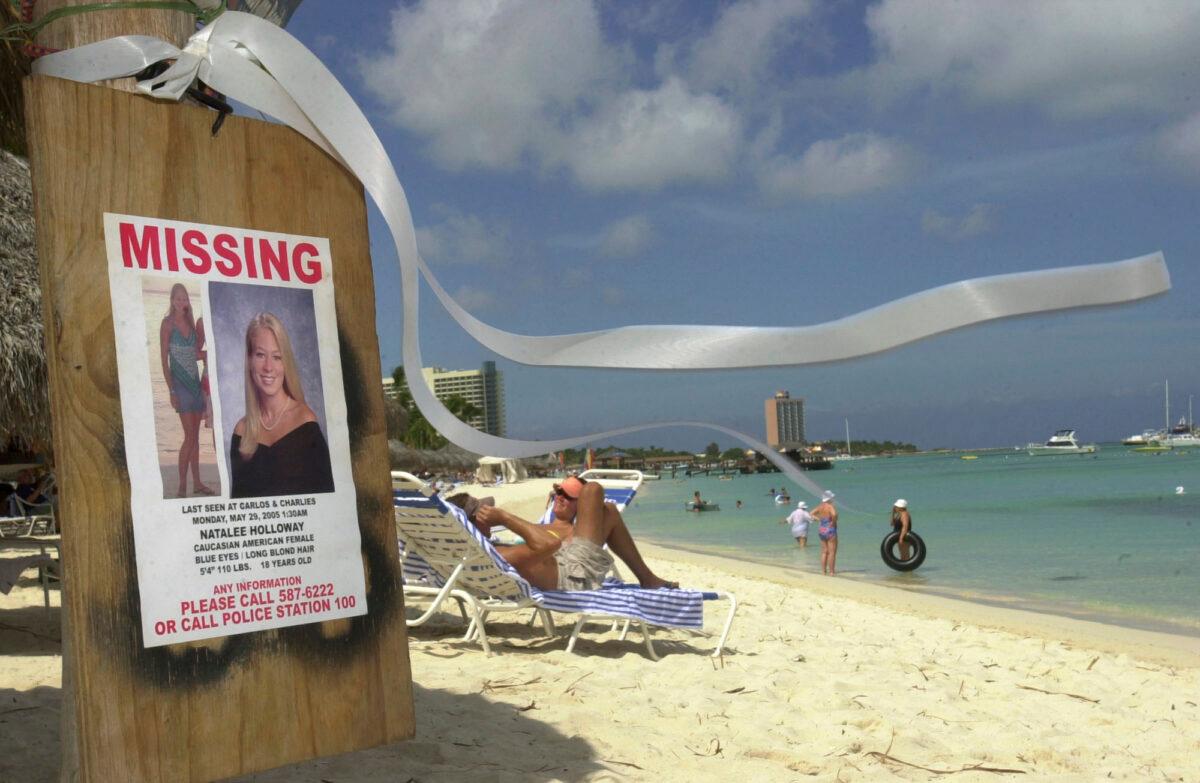 A sign of Natalee Holloway, an Alabama high school graduate who disappeared while on a graduation trip to Aruba, on Palm Beach, in front of her hotel in Aruba on June 10, 2005. (Leslie Mazoch/AP Photo)